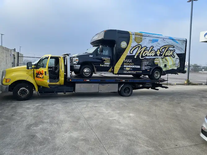 Flatbed towing involves loading your vehicle onto a flat, level platform on the back of the tow truck.